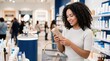 © Taras Roshchuk - A woman stands in a skin care store looking at a product in her hand. She has a shopping bag and is smiling. Others shop in the background