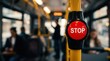 © Pinit - Daily travel in the city featuring a prominent stop button inside a public bus.