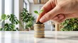 © Li - Hand planting green seedling in soil atop stack of gold and silver coins, symbolizing sustainable investment, financial growth, eco-friendly economy and wealth