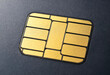© Nataliya - Macro close up view of microchip on black smart credit card surface detailing electronic security identity technology for digital banking