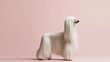 © Bonsales - Afghan hound dog standing in profile with long elegant white hair against a soft pink background