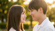 © Jesse_4160 - Close-up portrait of a young couple smiling and looking into each other eyes outdoors in a park at sunset