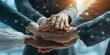 © Tasnim - Diverse hands stacked together in a gesture of unity and connection