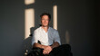 © BlackBridge Media - Thoughtful Man Sitting in Wheelchair with Dramatic Sunlight