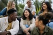© Formoney - Group of friends laughing together on outdoor steps