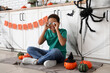 © Pixel-Shot - Teenage African-American boy with eyeballs and Halloween decor sitting in kitchen