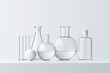 © Achirawee - A sterile lab table with test tubes and beakers set up for an experiment, with a clear background and room for text.