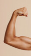 © AnyPic289 - Strong arm muscle flexing with clenched fist showing power and strength