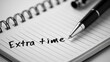 © wikkie - Handwritten phrase on a notebook page with a pen