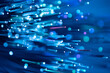 © ADDICTIVE STOCK - Fiber optic technology background with glowing blue light trails