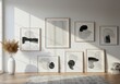 © Uravan - A gallery wall arrangement featuring several framed abstract artworks in a bright interior space with natural light ,office ,decor ,picture