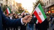 © Ayu - Person Holding an Iranian Flag During a Public Rally