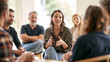 © CreativeArt - Young woman confidently speaking in a group discussion, sharing ideas and collaborating with diverse people during a meeting
