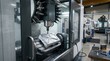 © fatkhul - Industrial cnc machine creating a metal component with precision manufacturing