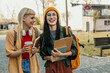 © La Famiglia - Diverse students walking on campus laughing and smiling