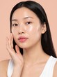 © mdnazirhossain - Young asian woman with glowing clear skin touching her face with hand beauty portrait
