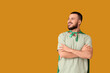 © Pixel-Shot - Young man with superhero cape on orange background