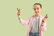 © Pixel-Shot - Cute little girl with tasty sausages on green background