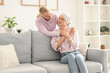 © Pixel-Shot - Young woman after chemotherapy with her mother hugging at home. Stomach cancer concept