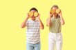 © Pixel-Shot - Little children with fresh citruses on yellow background