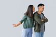 © Pixel-Shot - Young couple quarreling on light background