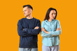 © Pixel-Shot - Offended young couple after quarrel on yellow background