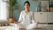 © Niks Ads - happy young indian woman doing yoga at home