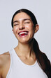 © Jacob Lund - Woman in her 20s laughing with gummy in studio