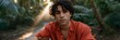 © Iryna - Tropical portrait of a young man in a lush garden background for banner and portrait design