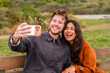 © Christine La/Stocksy - couple using cellphone together video call