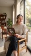 © Edina - A mature woman with elegant grey hair gazes at a framed photograph with a gentle smile, seated in a comfortable chair by a sunlit window, evoking a sense of cherished memory and quiet reflection.
