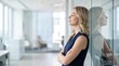 © Andriko - Professional Woman Taking a Moment of Quiet Reflection in a Modern Office Environment
