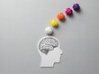 © ArtifyNow - Creative thought process illustration with paper cutout head and colorful crumpled paper balls