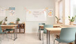 © dee-nesia - Teacher day banner on whiteboard in empty classroom