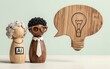 © YiuCheung - Wooden AI and human figures converse beside a speech bubble shaped like a lightbulb.