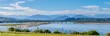 © stylefoto24 - Hokitika River Bruecke mit Blick auf die Suedlichen Alpen, Panorama vom Fluss zu bewaldeten Huegeln und Bergketten, Westcoast, Suedinsel, Neuseeland, ruhiges Wasser mit gruener Uferzone