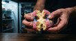 © sofkhal_dj - Hands breaking open pink frosted donut with cream filling