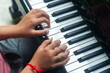 © cookiecutter - Young Child Playing Piano Keyboard