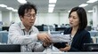 © Moh Kifly S Rasyid - Stressed Asian male worker handing a large stack of documents to a female colleague