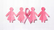 © Iqrabatool - Pink Paper Cutout People Holding Hands With Ribbon On White Background