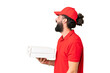 © luismolinero - Pizza delivery man with work uniform picking up pizza boxes over isolated chroma key background laughing in lateral position