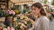 © Elegance Frames - Young woman shopping for fresh spring flowers at a local outdoor market