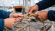 © Kassandra - Instructor teaching nautical knot tying on sailboat