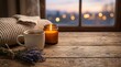 © Design Store - Cozy mug of hot tea steaming next to lit candle and soft sweater on rustic wooden table with lavender bouquet.