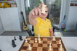 © Volodymyr - Kid playing chess at home. Child thinking over chess move. Kids learn strategy with chess. Kid concentrating on chessboard. Teen studying chess game. Thoughtful child playing chessgame at desk.