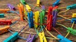 © yolania - Colorful paintbrushes and pencils scattered on wooden surface.