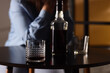 © Pixel-Shot - Alcohol addiction and substance abuse with a person in distress and a glass of whiskey on a table, Moody atmosphere, emphasizing the challenges of an unhealthy coping mechanism