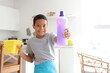 © Pixel-Shot - Cute little African-American boy with cleaning supplies in kitchen
