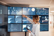 © Westend61 - Medical professional analyzing AI data on large monitors in clinic