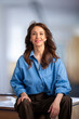 © sepy - Confident mature businesswoman sitting in an office